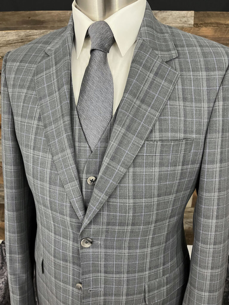 Classy dove-gray color plaid suiting, woven from a fine blend of wool & cashmere. With it's lightweight feel, this suit is great for hot weather, but can also be easily layered during the fall & winter.