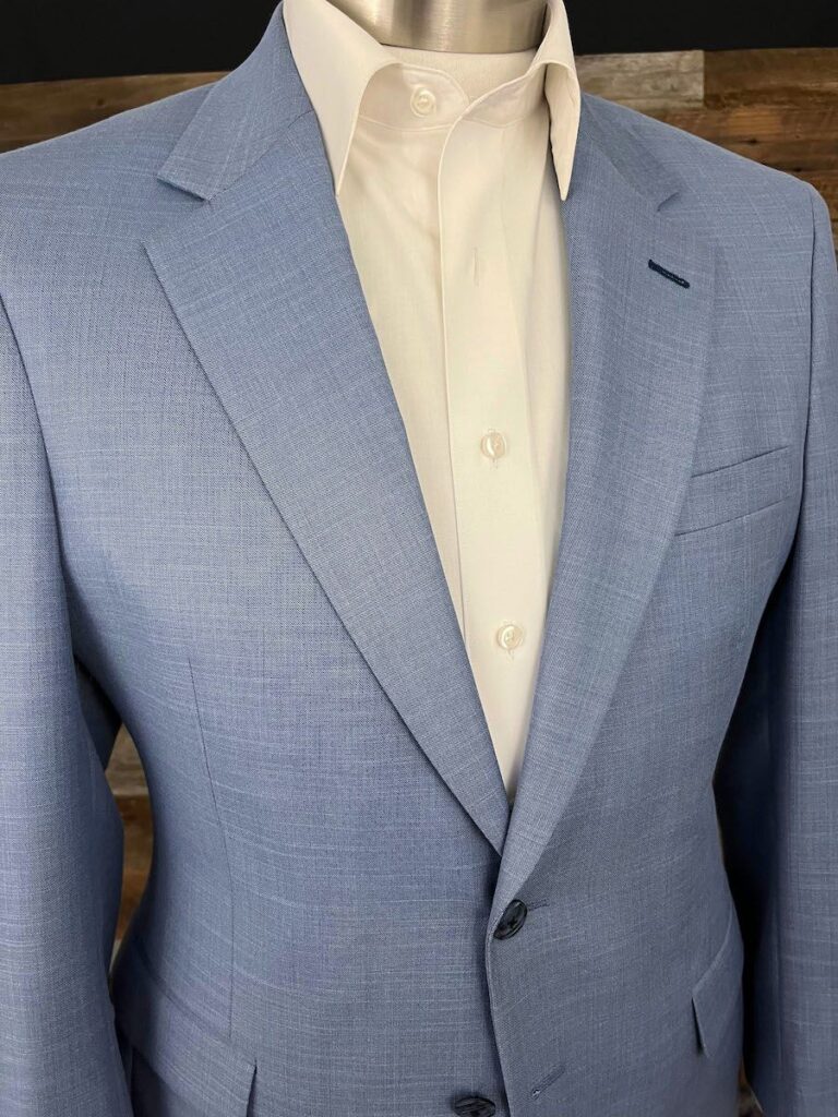 Cool off with this (literal) cool capri-blue suiting, made in a breathable and lightweight mixture weave. A perfect fabric for those tropical vacations and late-summer weddings!