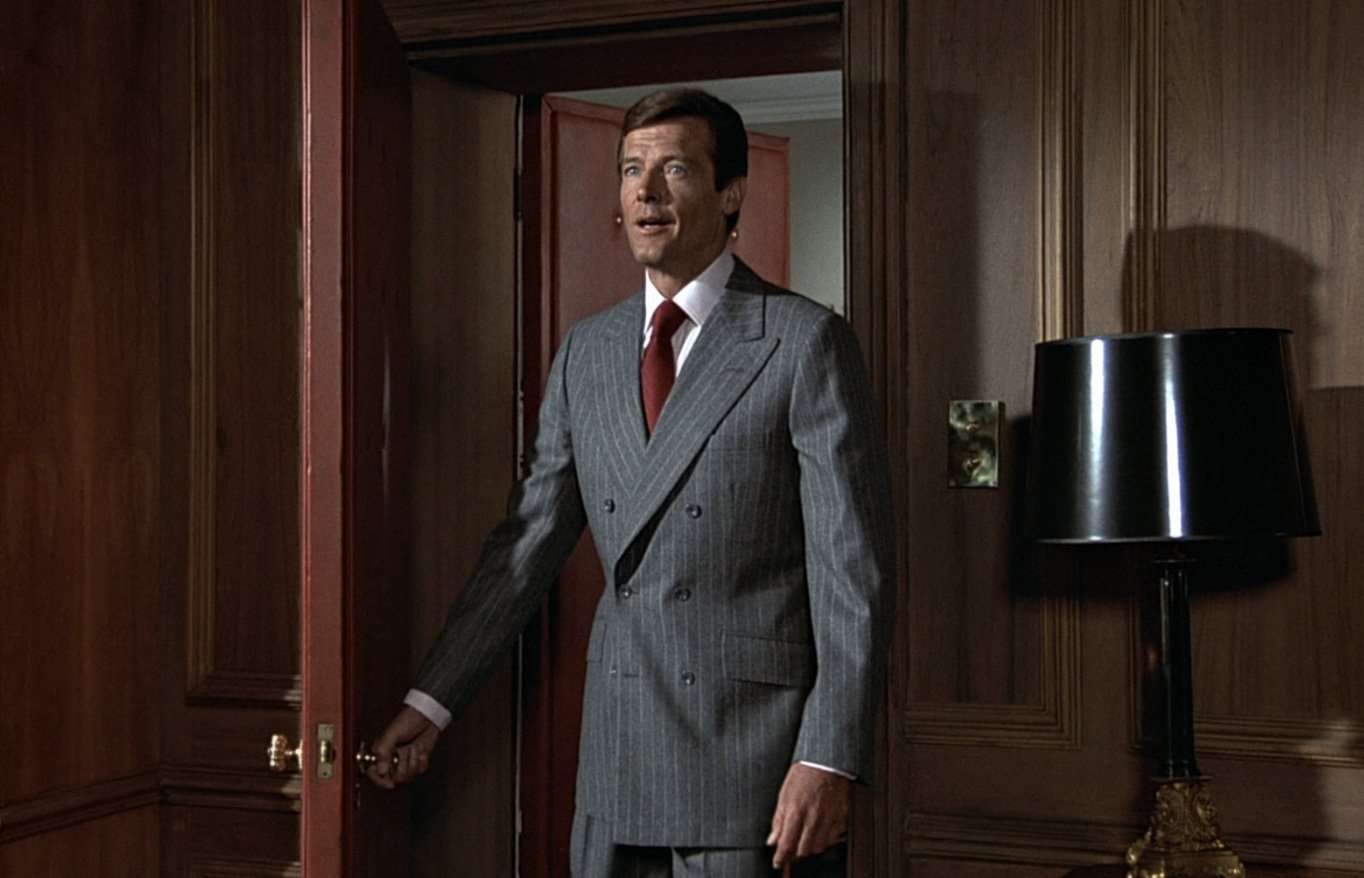 Roger Moore as James Bond donned a double-breasted suit with stylish results.